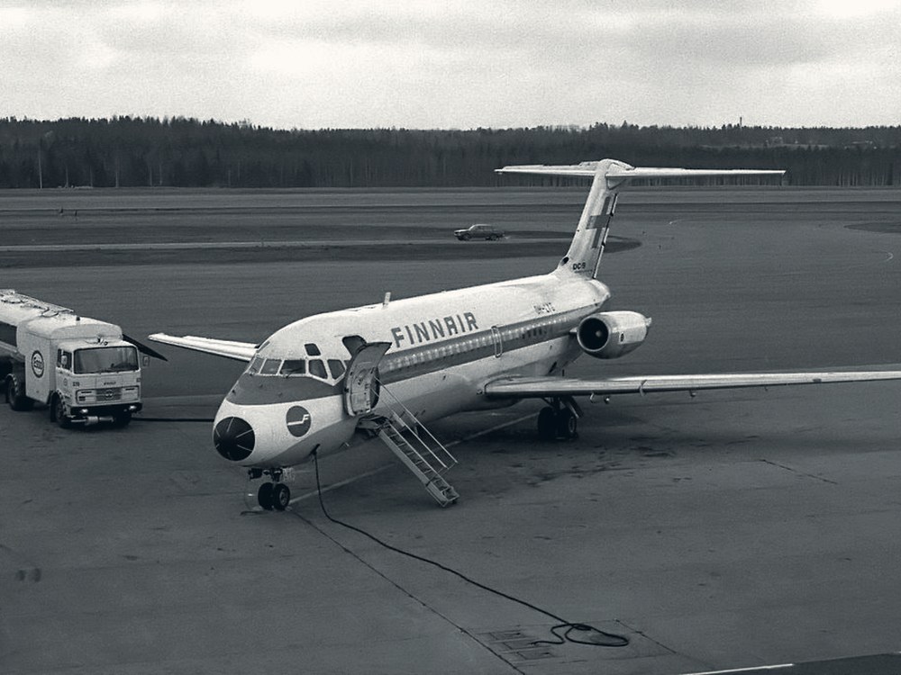 Historical photograph of a Finnair aircraft being serviced on the ground